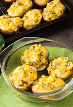 Stuffed baked potato with eggs, cheese and spices