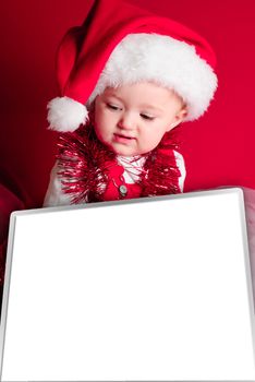 Baby in Santa hat with blank board