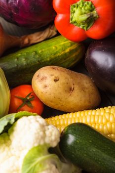 Vegetables background on the wooden table closeup