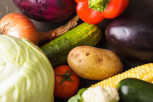 Vegetables background on the wooden table closeup