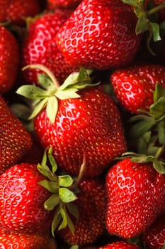 Strawberry berries close up as a background