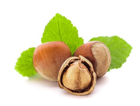 Hazelnuts with shell and green leaf isolated