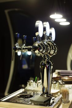Beer taps in a bar for spilling drinks
