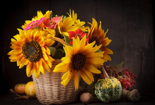 Still life with autumn harvest on wood background