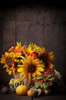 Still life with autumn harvest on wood background