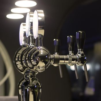 Beer taps in a bar for spilling drinks