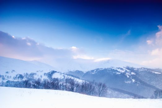 Winter snow mountain landscape before the storm