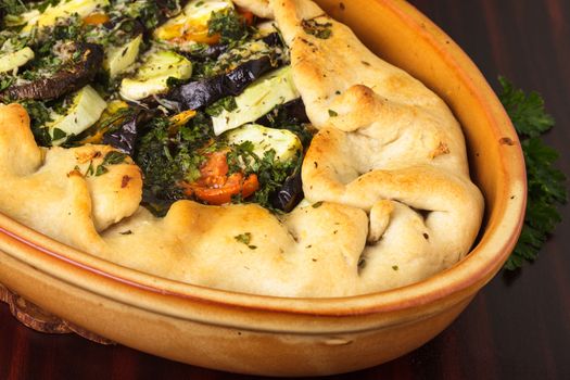 Cake with vegetables, baked in the pottery