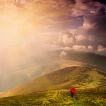 Tourist on the path high up in Carpathian mountains