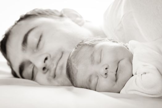 Sleep baby with dad, closeup faces