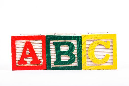 Color wooden alphabet blocks isolated on white