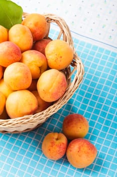 Apricots in a basket on the table