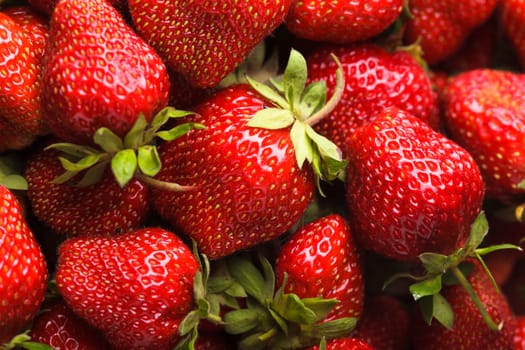 Strawberry berries close up as a background