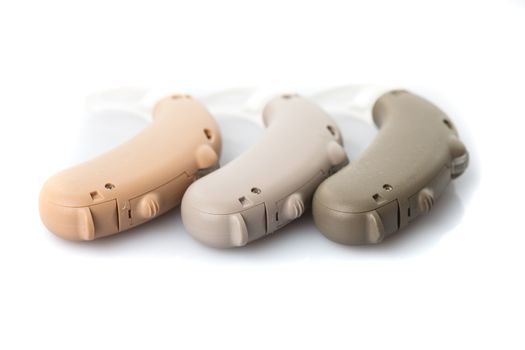 Digital hearing aids in the color of the skin