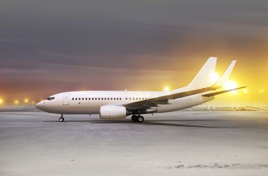 white aircraft in airport at non-flying weather, blowing snow