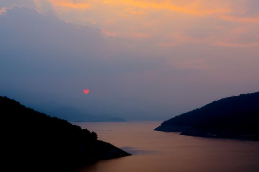 Red sunset on the big blue mountain range