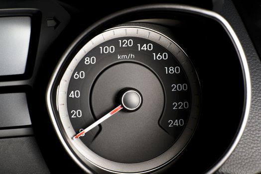 Photo presents car's, vehicle's speedometer or tachometer with visible information display - ignition warning lamp  and brake system warning lamp, visible symbols of instrument cluster ( ten check warning light).