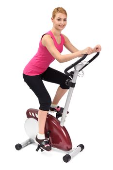 young woman doing indoor biking exercise, on white background