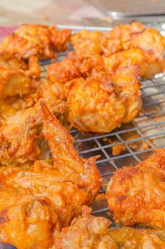 Hot fried chicken wings sale in the fresh food market at Rayong Thailand