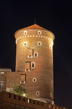 night view of sandomierska tower on wawel royal castle in cracow in poland