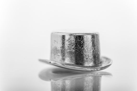 A close-up shot of a monopoly game token on a white background