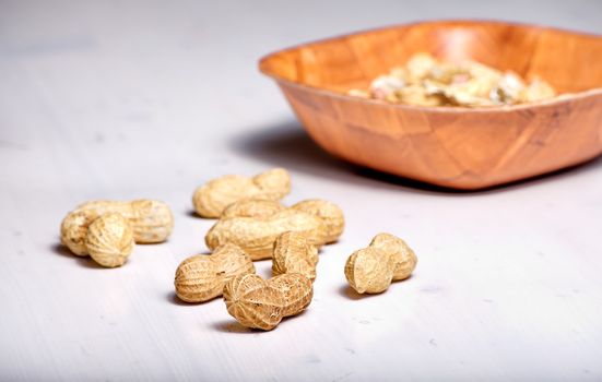 Peanuts in a brown bowl