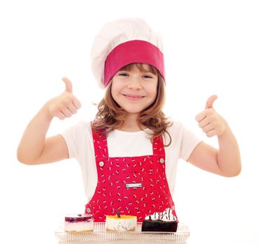 happy little girl cook with thumbs up and cakes