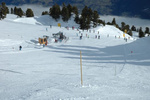 Ski slope, lift and skiers in Austria nearby Kaltenbach in Zillertal valley