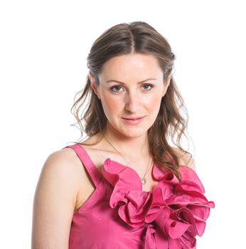 Portrait of cute female fashion model posing in pink dress. Isolated on white, studio shot