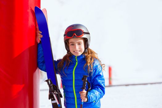 Kid girl winter snow with ski equipment helmet goggles poles