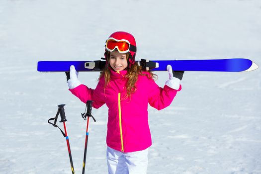 Kid girl winter snow holding ski equipment helmet goggles poles