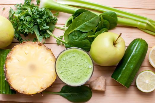 healthy organic green detox juice on wood