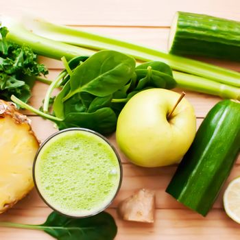 healthy organic green detox juice on wood