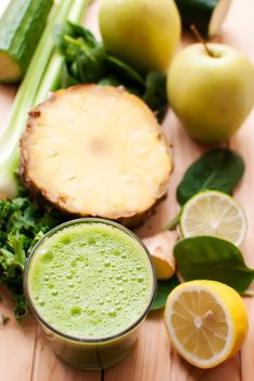 healthy organic green detox juice on wood