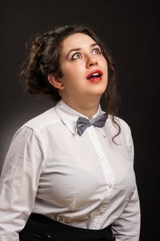 stylish astonished woman portrait , with dark background