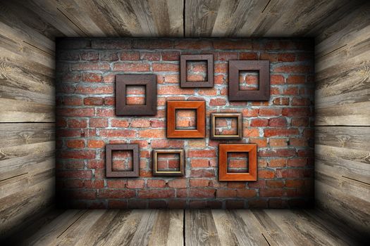 empty room with frames on abstract brick wall