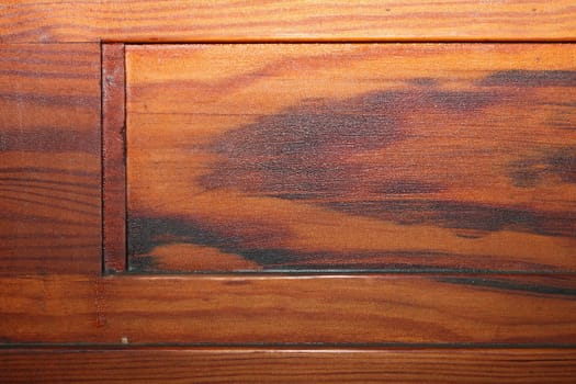 detail of beautiful textured red pine plank on old furniture