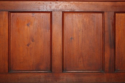 red pine wood texture on an old piece of furniture