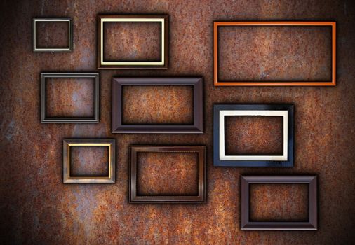 rusty wall full of empty frames ready for your design or message