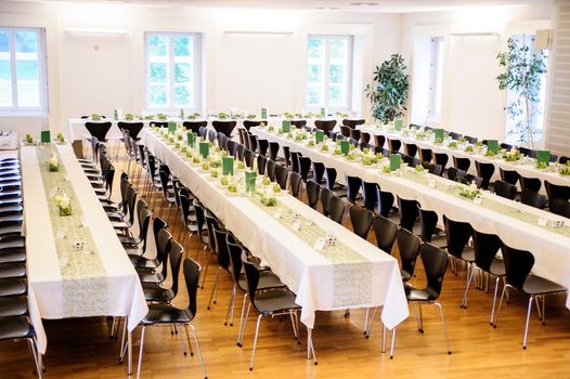 Festive Hall with decorated tables on a wedding celebration