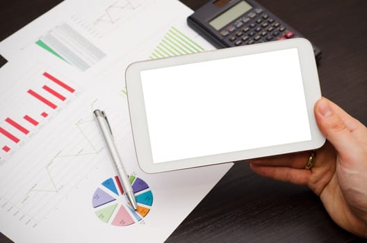 Tablet pc with empty white screen. Modern workplace in office