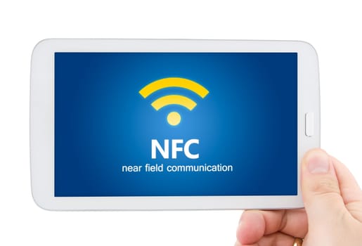 Hand holding tablet with NFC. Technology of wireless payment method