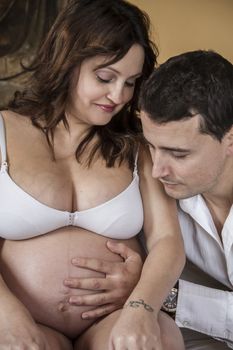 Mom, Family With Pregnant Mother Relaxing On bed Together