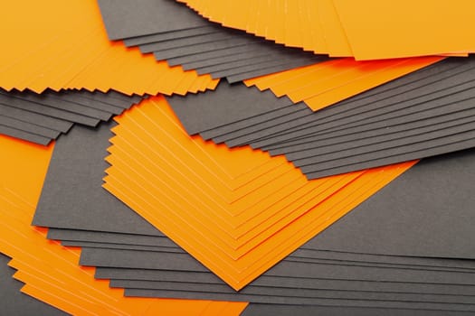 Black and orange sheets paper closeup background