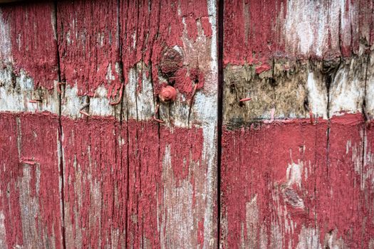 An old wooden door painted in red