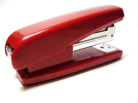 Red stapler isolated on the white background
