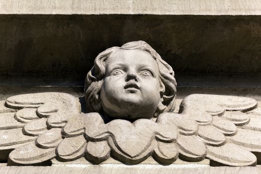 Bas-relief of a small angel on facade of church