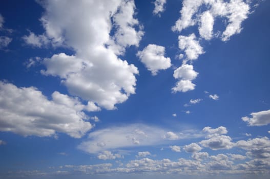 White cumulus clouds and blue sky