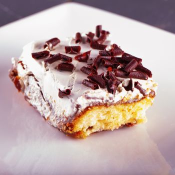 Slice of cake with cream and chocolate