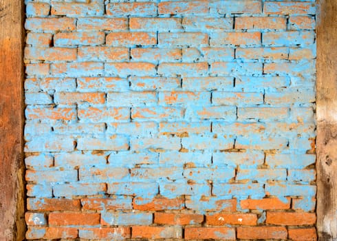 Blue painted brick wall texture, timbers on both sides
